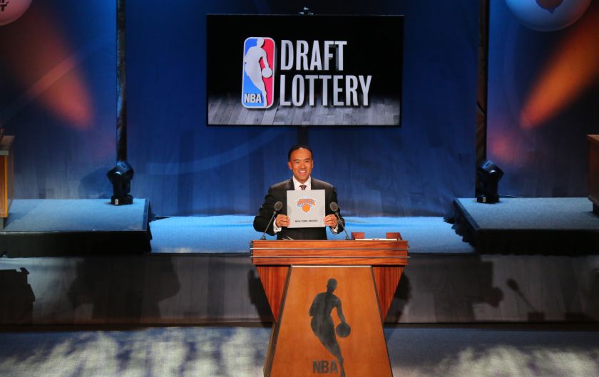 NBA Deputy Commissioner Mark Tatum, left, announces that the New York Knicks have won fourth pick during the NBA draft lottery in New York.